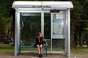 girl at bus stop