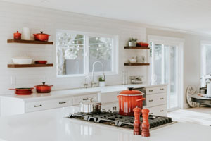 A photo of a kitchen with a red pot