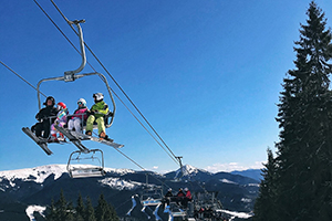 skiers on lift at bukovel