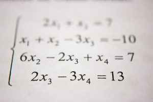 A close-up image of several math equations