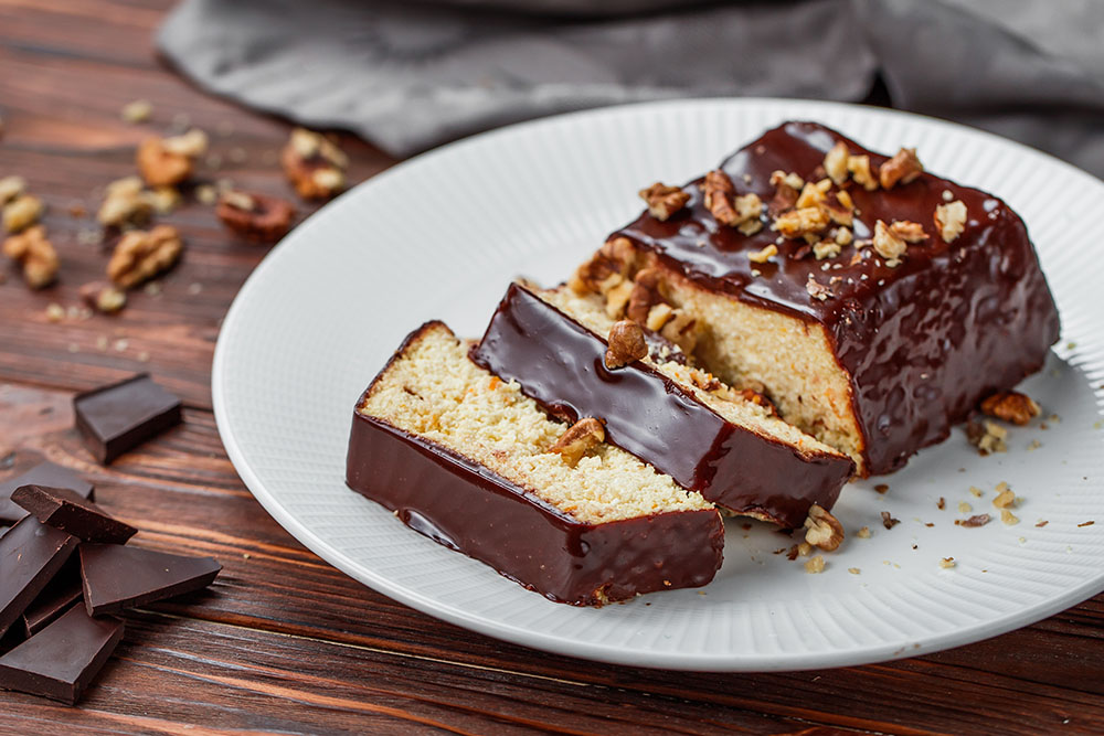 cheesecake covered with chocolate and nuts